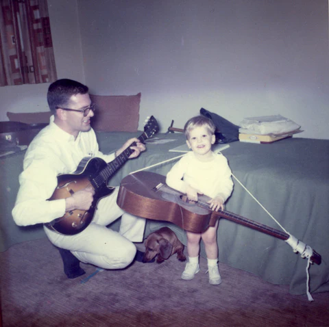 Gene Upton and youg son Mike Upton play guitar together